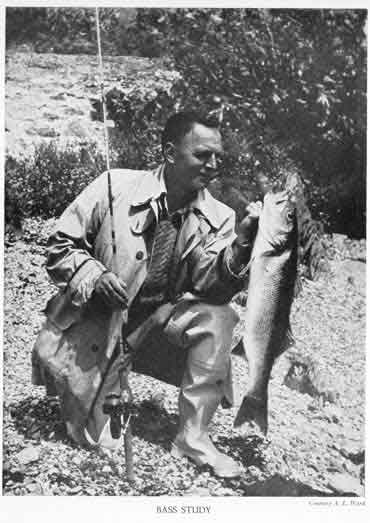 angler posing with bass
    