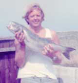 Image of bob alexander holding up 10 pound bass
