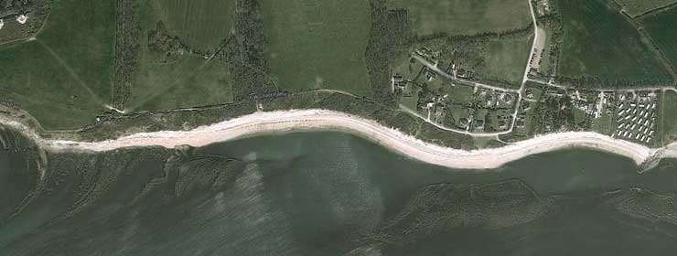 google maps satellite image of ringstead beach showing the offshore reef